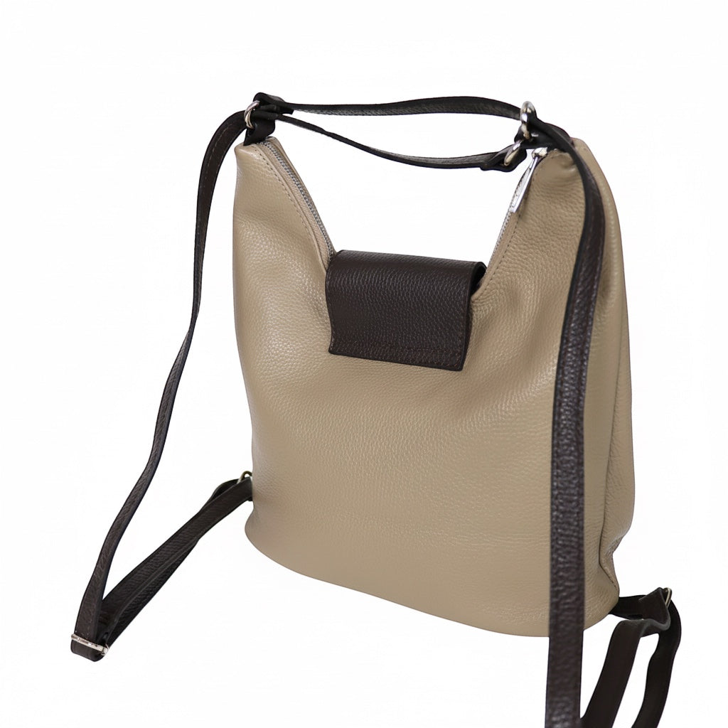 Eclectic Donatello Duo taupe grain leather convertible bag with black contrast straps and silver-tone hardware.