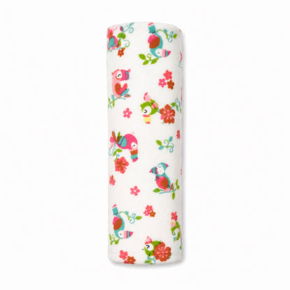 Eclectic Toucan Paradise cotton flannel baby swaddle featuring colourful toucans and flowers on a white background.