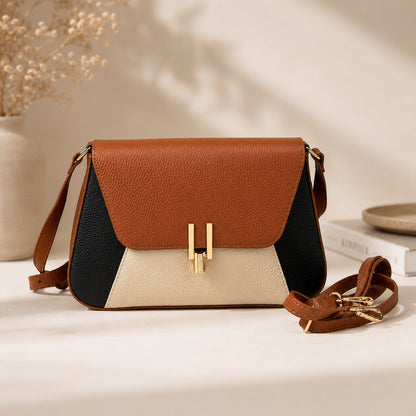 Eclectic Firenze tricolour grained leather crossbody bag in tan, black, and cream with gold-tone hardware.