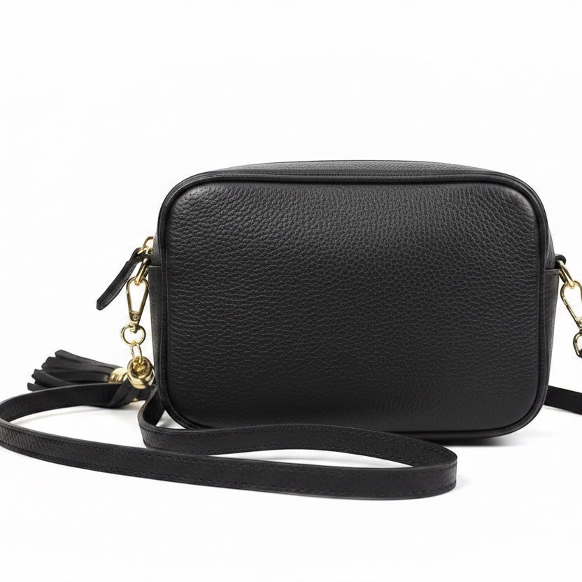 Eclectic Venezia black Italian leather crossover bag with a decorative metallic tassel and adjustable shoulder strap.