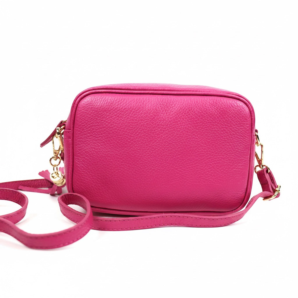Eclectic Venezia fuchsia Italian leather crossover bag with gold hardware and tassel detail