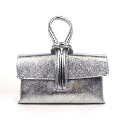 Eclectic Venezia metallic silver leather wristlet bag with a unique looped handle design on a white background.