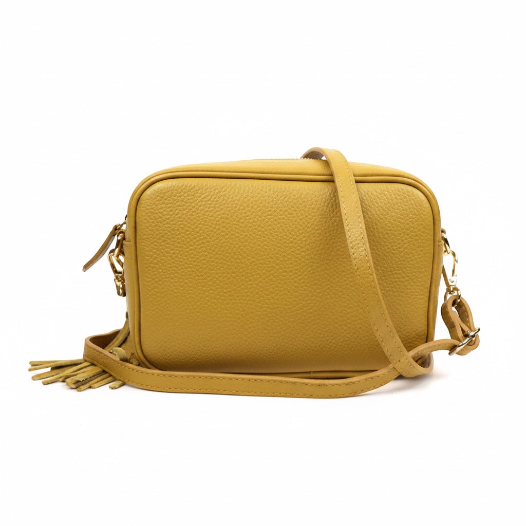 Eclectic Venezia mustard yellow Italian leather crossover bag with a decorative tassel and adjustable shoulder strap
