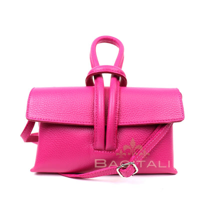 Eclectic Venezia hot pink pebbled leather wristlet bag with a detachable strap and minimalist flap design.