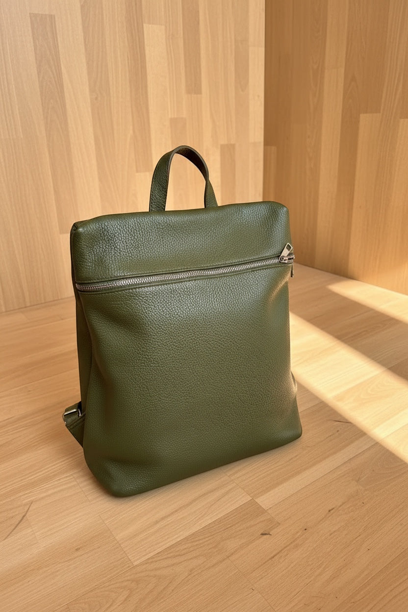Eclectic Verona olive green pebbled leather backpack with a structured silhouette and front zip pocket