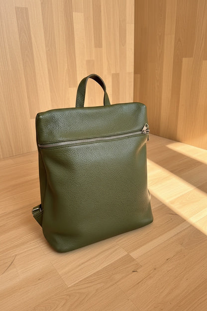 Eclectic Verona olive green pebbled leather backpack with a structured silhouette and front zip pocket