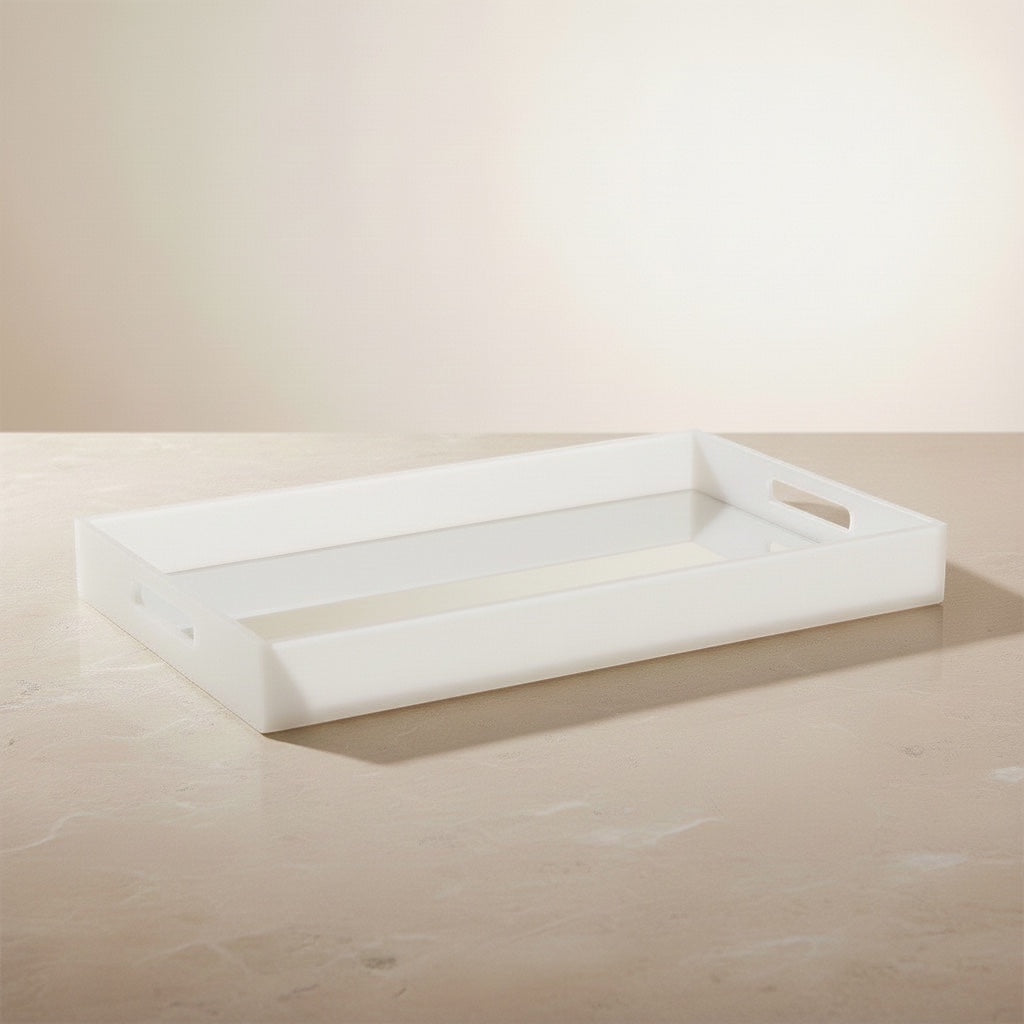 Eclectic white acrylic serving tray with a mirrored base and integrated handles on a neutral surface.