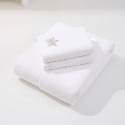 Eclectic white 100% cotton guest towel featuring an elegant embroidered crown detail for a sophisticated bathroom look.