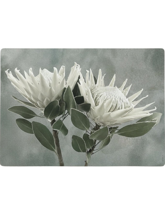 Eclectic White King Protea reusable placemat with botanical illustration in soft neutral tones on a green background.