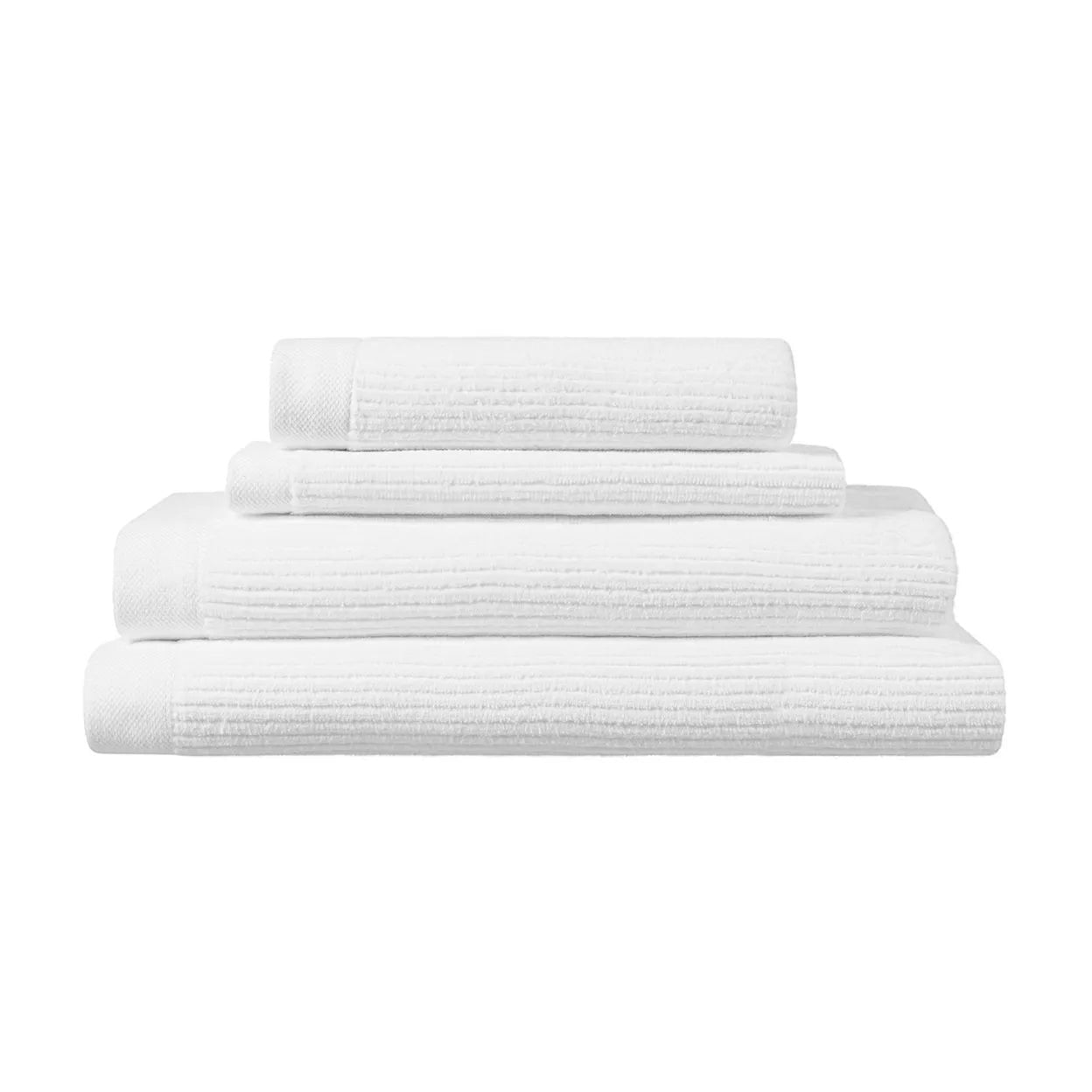 Eclectic white velvet cotton guest towels stacked neatly, featuring a soft, absorbent texture and elegant finish.