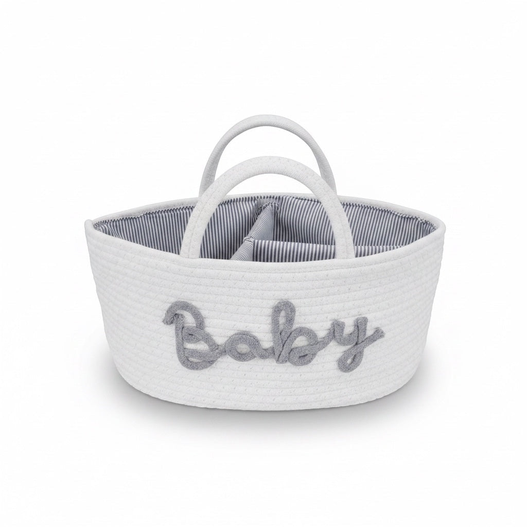 Eclectic white woven cotton rope baby storage basket with grey Baby embroidery and striped interior lining.