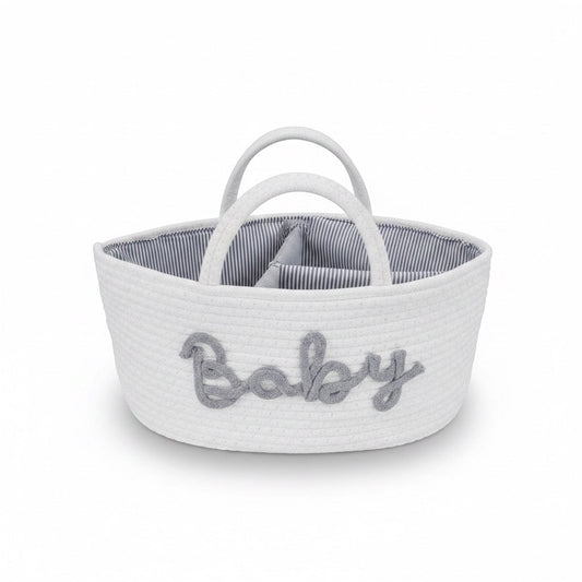 Eclectic white woven cotton rope baby storage basket with grey Baby embroidery and striped interior lining.