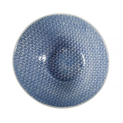 Eclectic Wonki Ware handcrafted pottery salad bowl with a blue and white floral pattern, top-down view.
