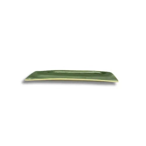 Eclectic Wonki Ware long skinny green pottery serving dish with a smooth glazed finish for tapas and nibbles.
