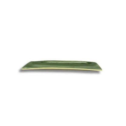 Eclectic Wonki Ware long skinny green pottery serving dish with a smooth glazed finish for tapas and nibbles.