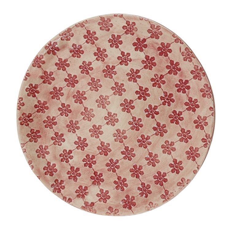 Eclectic Wonki Ware extra large round stoneware serving bowl with a hand-impressed red floral pattern on a pink wash.