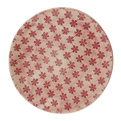 Eclectic Wonki Ware extra large round stoneware serving bowl with a hand-impressed red floral pattern on a pink wash.