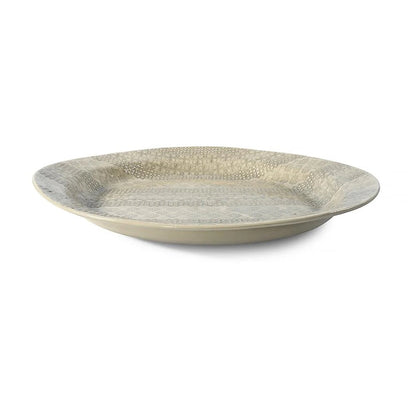 Eclectic Wonki Ware large handcrafted Mediterranean pottery platter with a shallow shape and textured floral pattern.