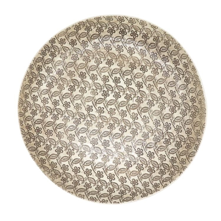 Eclectic Wonki Ware large handcrafted pottery pie dish with a detailed floral and leaf pattern in neutral tones.