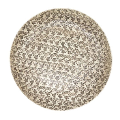 Eclectic Wonki Ware large handcrafted pottery pie dish with a detailed floral and leaf pattern in neutral tones.