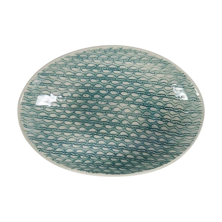 Eclectic Wonki Ware oval stoneware bowl with a blue hand-painted net pattern on a white glazed surface.
