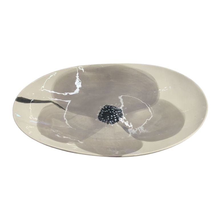Eclectic Wonki Ware oval stoneware bowl in warm grey with a hand-painted poppy motif and organic glaze finish.