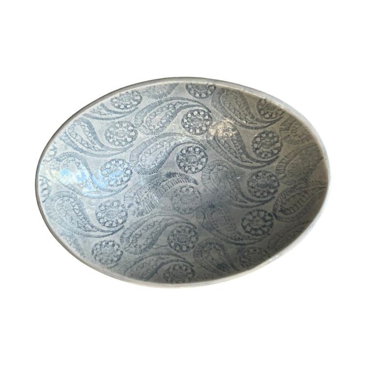 Eclectic Wonki Ware oval stoneware bowl featuring a grey hand-stamped paisley pattern on a white glazed surface.