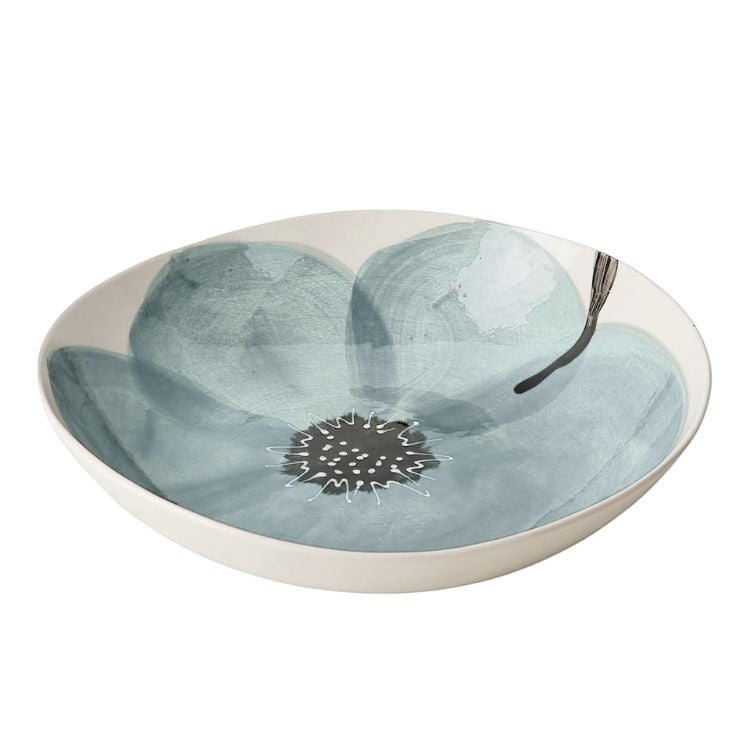 Eclectic Wonki Ware Poppy Collection large handmade pottery spaghetti bowl with a blue hand-painted floral motif.