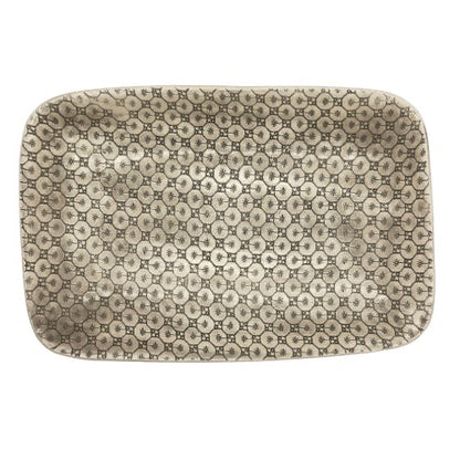 Eclectic Wonki Ware rectangular stoneware roasting platter with a unique hand-impressed lace pattern in neutral tones.