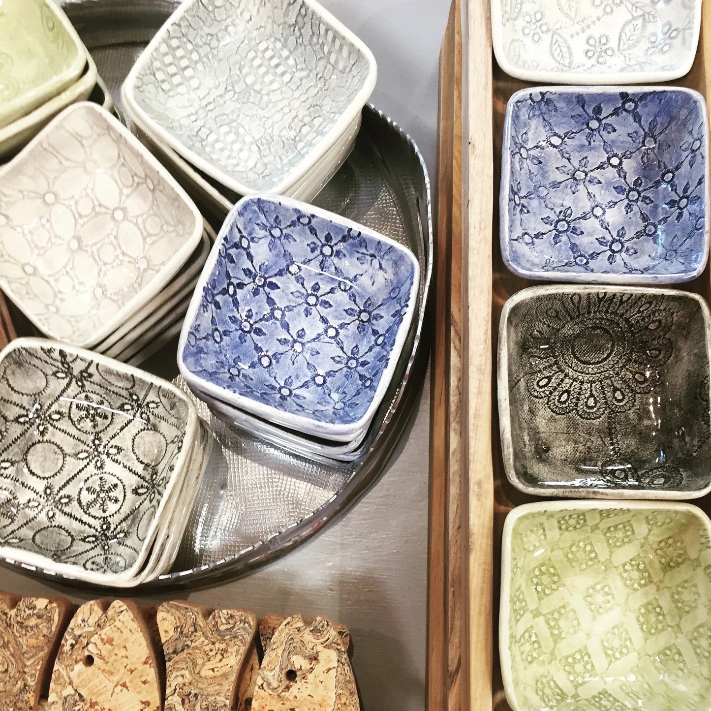 Eclectic Wonki Ware handcrafted square ceramic ramekins in various blue, green, and neutral patterned glazes.