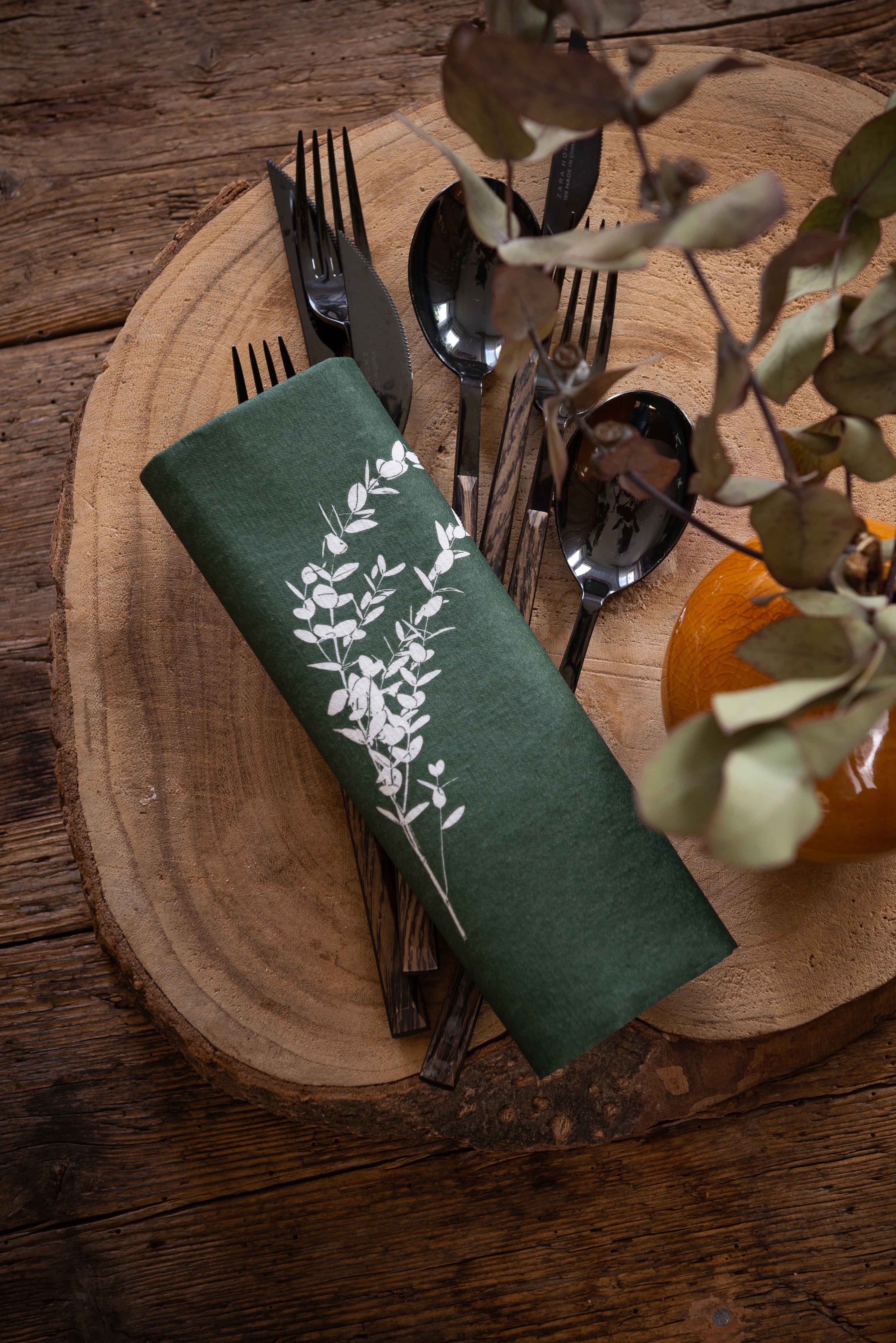 Françoise Paviot table linen collection with folded napkins and dining accessories.