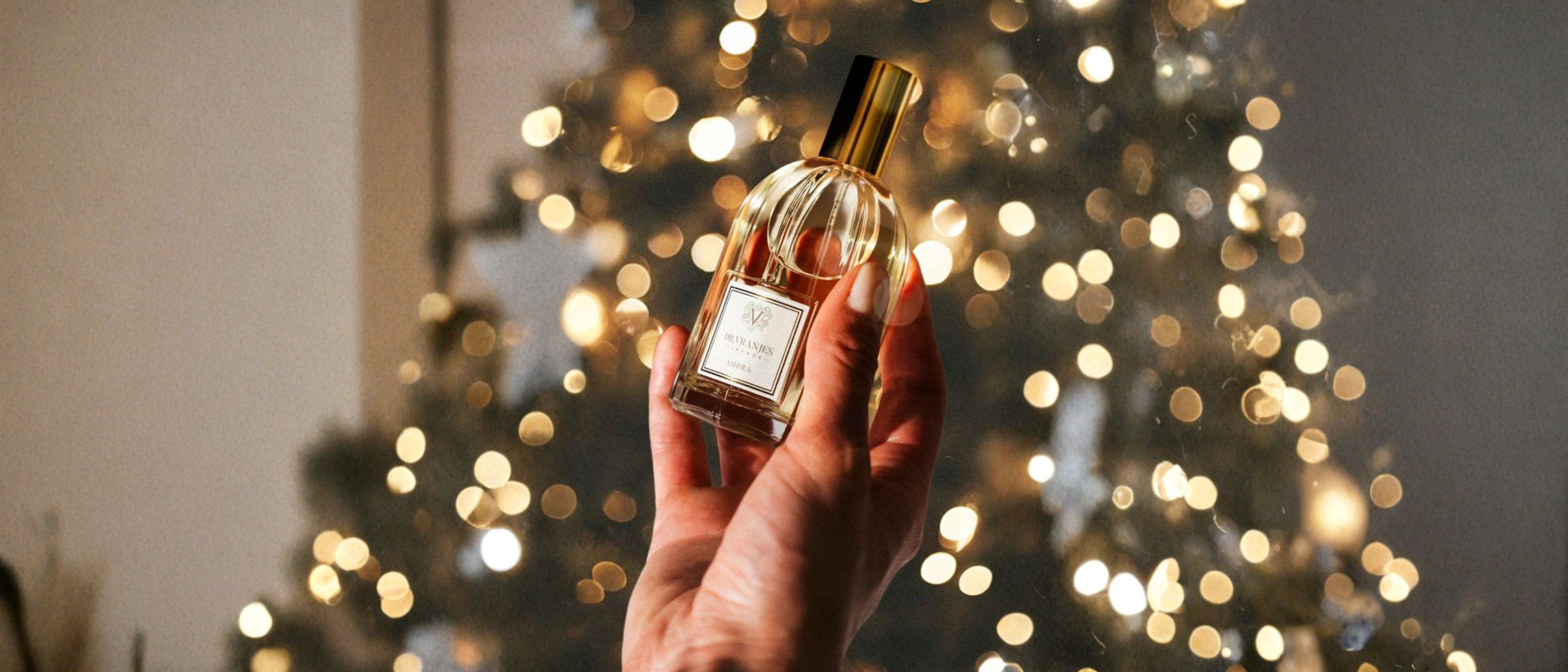 Room and linen spray bottle held in front of warm decorative lights.