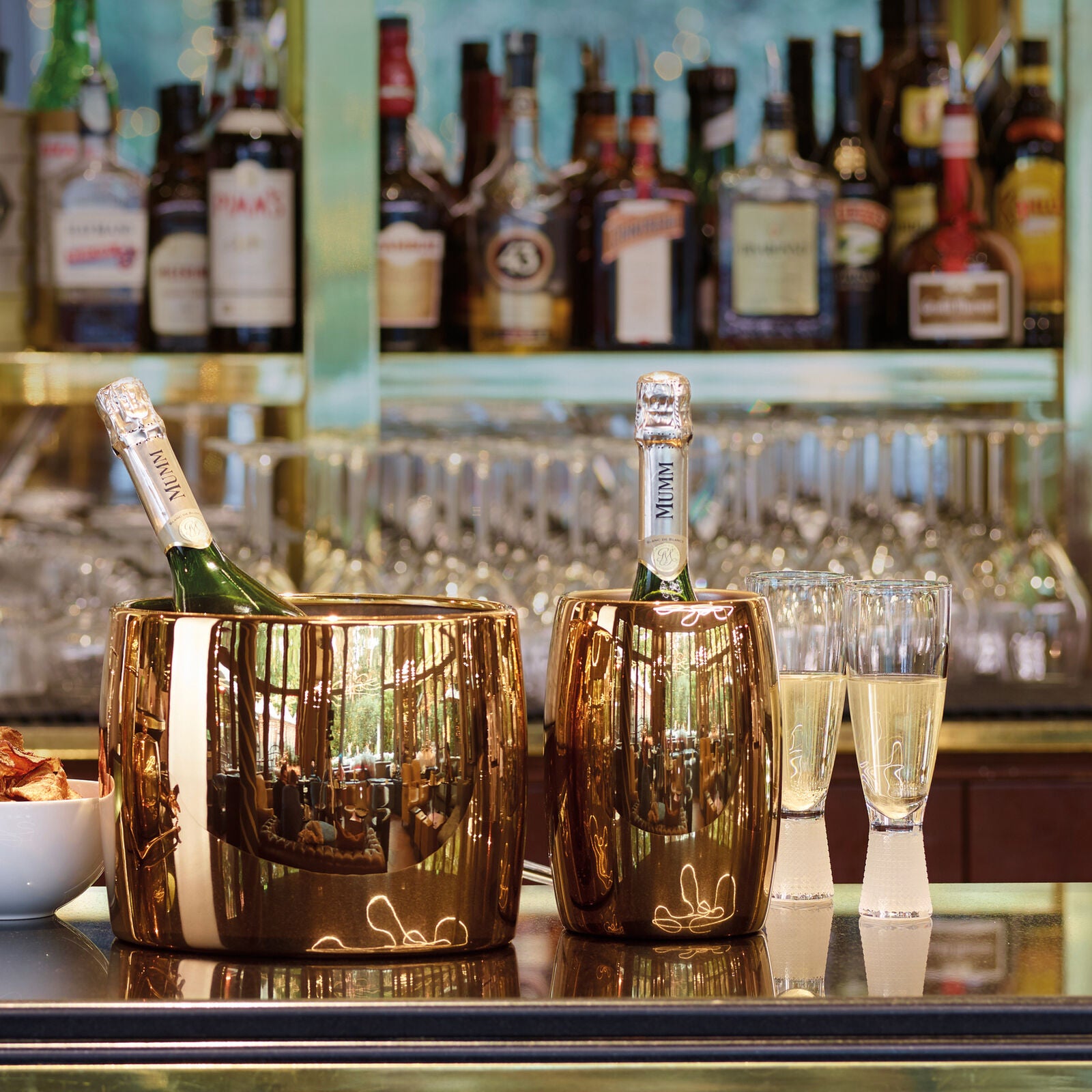 Sambonet luxury barware collection with metallic glassware and accessories.