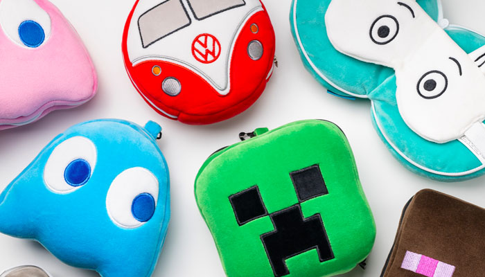 Colourful children’s travel pillow sets with playful animal and character designs.
